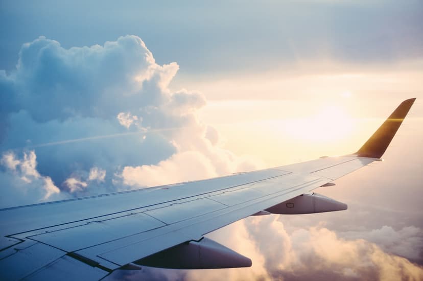 Aircraft wing above the clouds on a booked flight